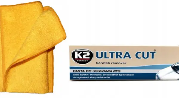 Żółta mikrofibra i pasta K2 Ultra Cut do usuwania rys z lakieru samochodowego.