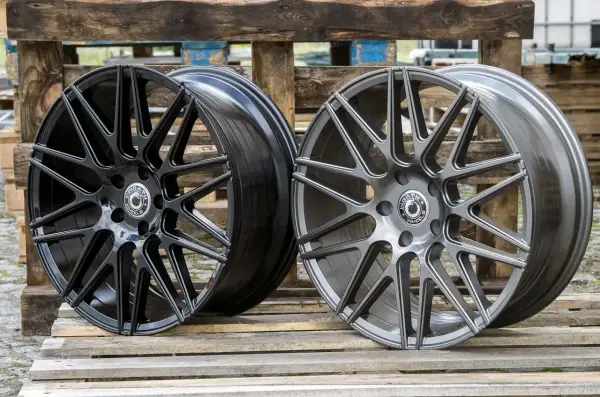 Dwa stylowe felgi aluminiowe: jedna w głębokiej czerni, druga w eleganckim grafitowym odcieniu. Różnorodne kolory felg aluminiowych dla każdego gustu.